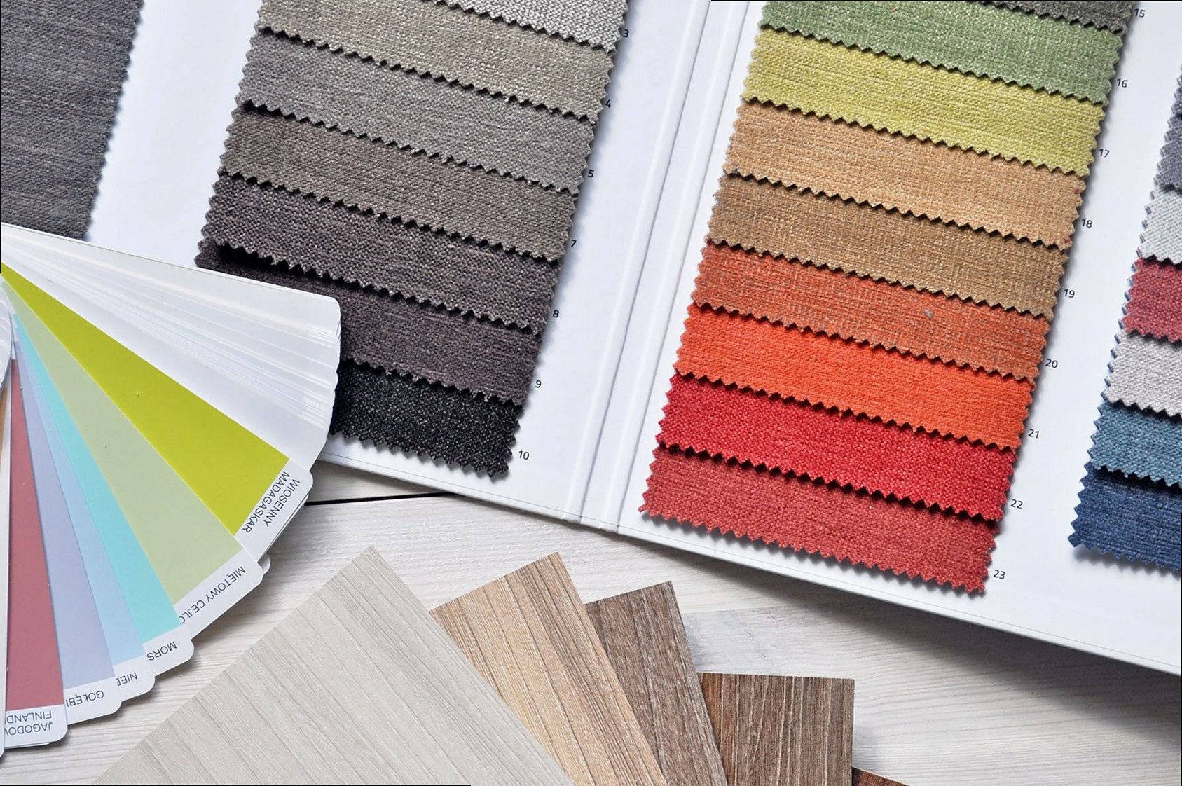 Colorful fabric and paint swatches laid out for design inspiration and material selection.
