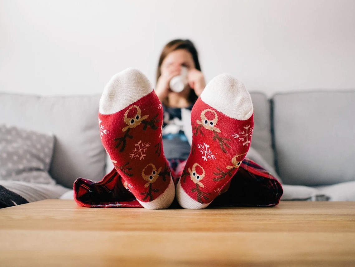 christmas wallpaper, feet, socks, living room, person, relaxing, table, couch, woman, lazy, pajamas, xmas, reindeer, rel